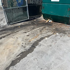 Dumpster pad cleaning before